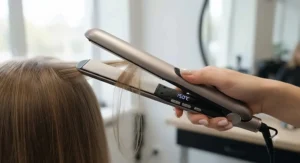 Close up of professional hair straighteners with adjustable heat settings for fine hair