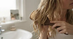 Flexible-bristle detangling hair brush for fine hair gently gliding through wet blonde locks