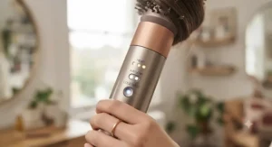 Detailed view of LED heat and airflow settings on the best multi-styler hair tool during styling