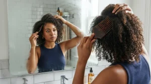 Gentle detangling technique using an afro pick for natural hair on damp coils